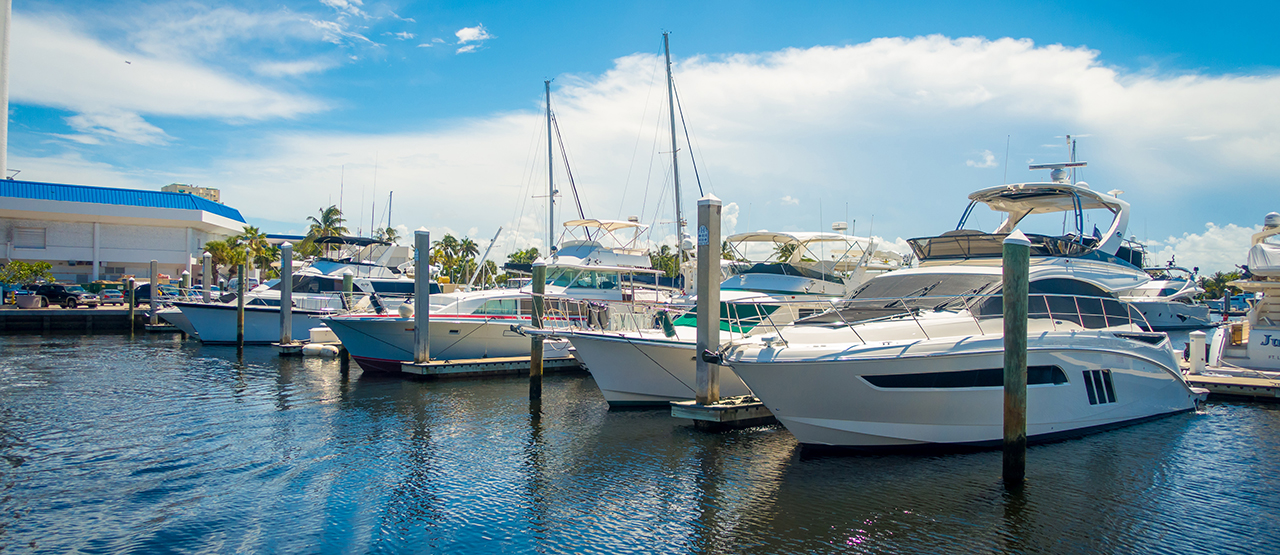Boats being displayed in the water on a sunny day at the Fort Lauderdale International Boat Show in Florida