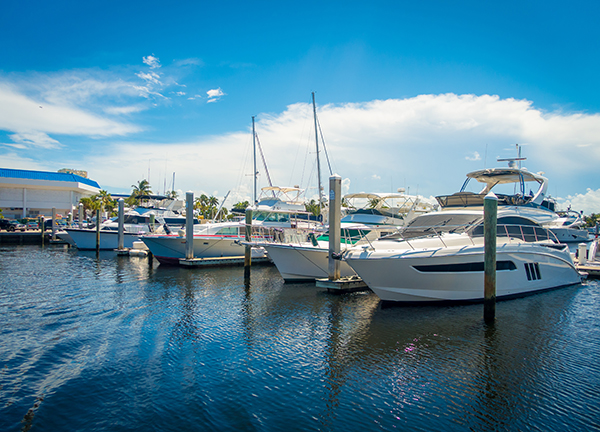 Boats being displayed in the water on a sunny day at the Fort Lauderdale International Boat Show in Florida