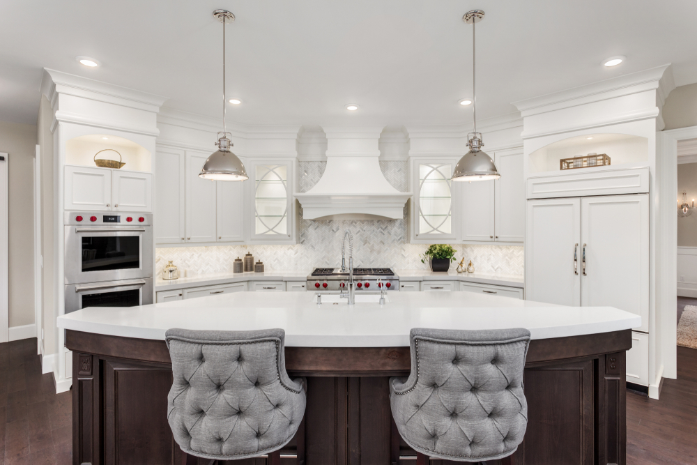 dark colored island in white kitchen