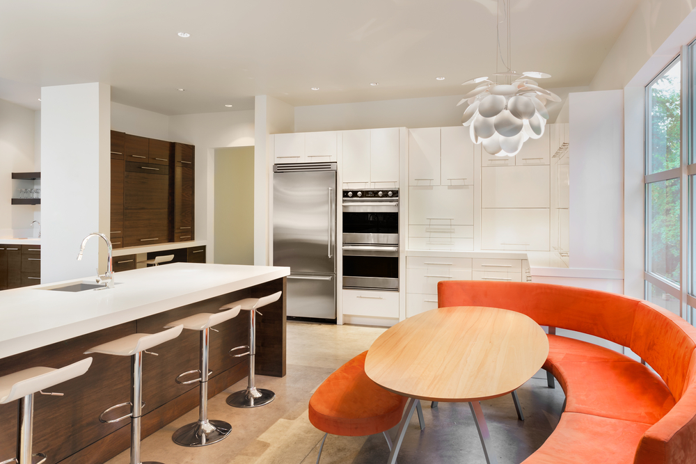 orange banquet seating in white kitchen