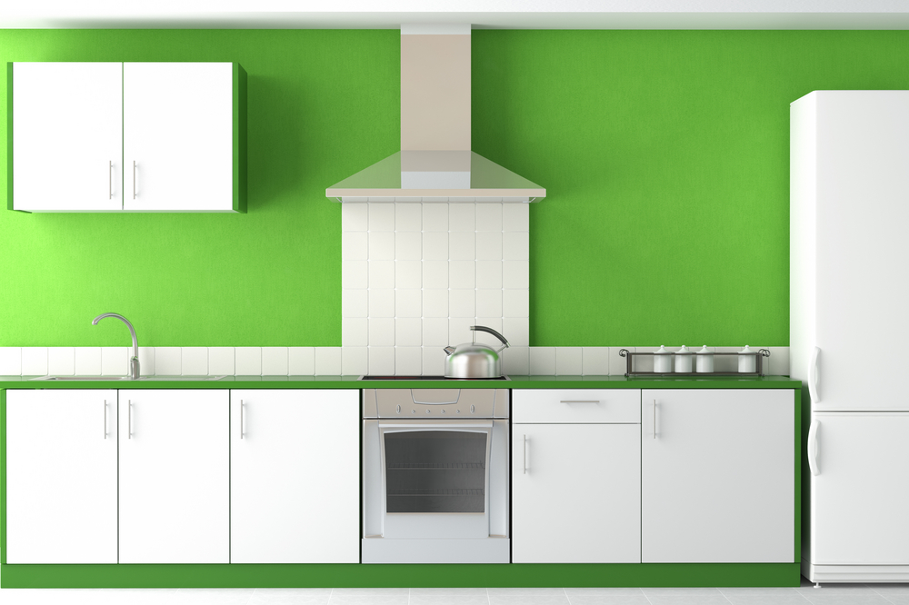 Bright green wall in white kitchen