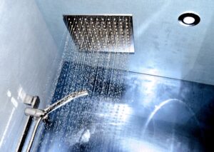 silver shower head built into ceiling